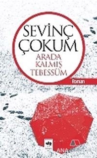 Arada Kalmış Tebessüm